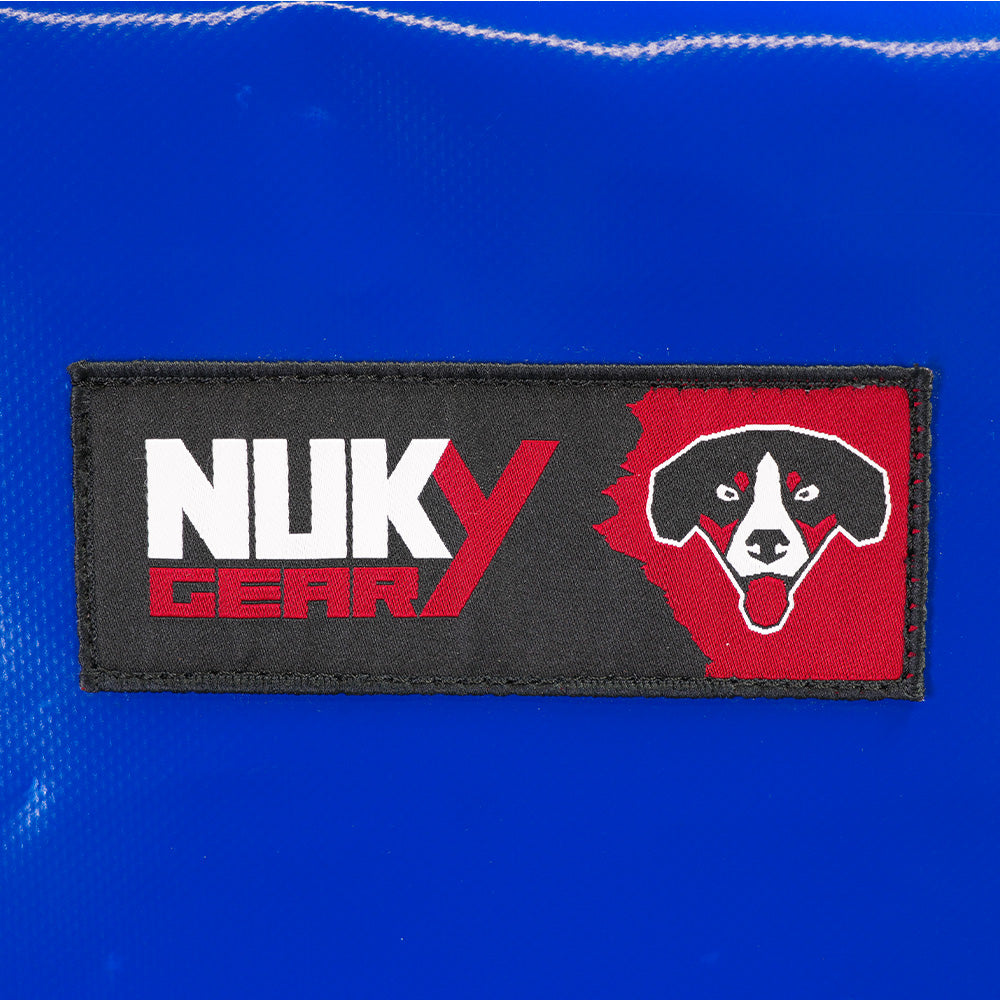 Defense shield for service dog training, robust blue canvas material. Detail