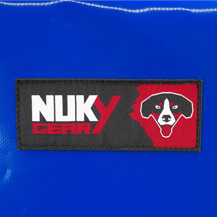 Defense shield for service dog training, robust blue canvas material. Detail